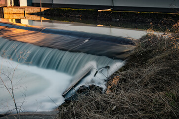 Shot of a waterfall flowing down the dam