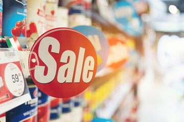 Product discount labels on the shelves in the mall,sale label.