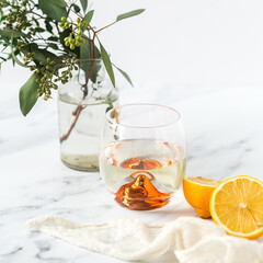 Two wine glasses on a marble background