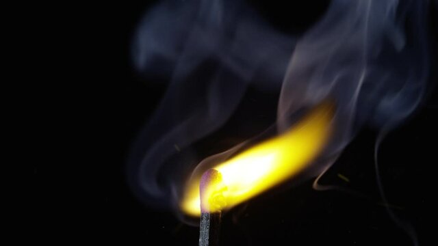 detail shot of match being ignited