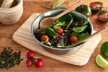 Green sprout salad, lettuce, spinach, cherry tomato, seeds, radish and lime