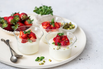 Malabi (muhallebi) milk pudding  with strawberries and pistachios