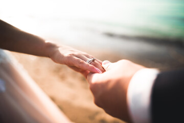 Wedding couple bride and groom holding hands