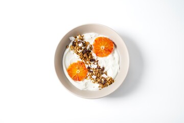 Fototapeta na wymiar Bowl with yogurt granola and red oranges