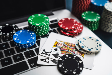 gambling online bet, table with keyboard, cards and poker chips