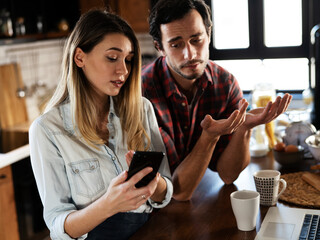 Boyfriend and girlfriend are arguing. Jealous girlfriend having an argument with her boyfriend