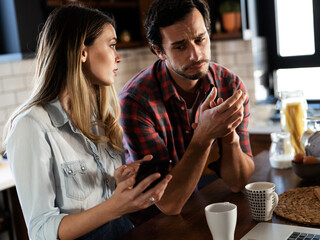 Boyfriend and girlfriend are arguing. Jealous girlfriend having an argument with her boyfriend
