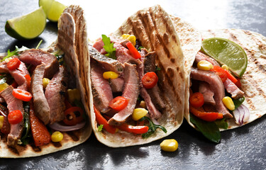 Mexican tacos with guinea, pepper and corn. Traditional Mexican dish.