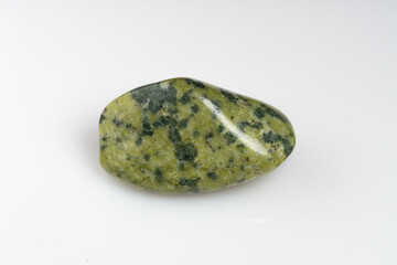 Natural stone green serpentine on a white background