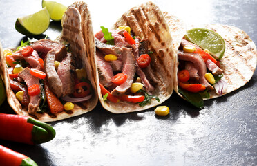 Mexican tacos with guinea, pepper and corn. Traditional Mexican dish.