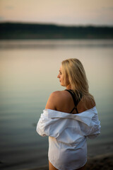 blonde girl in white shirt on the beach, selective focus