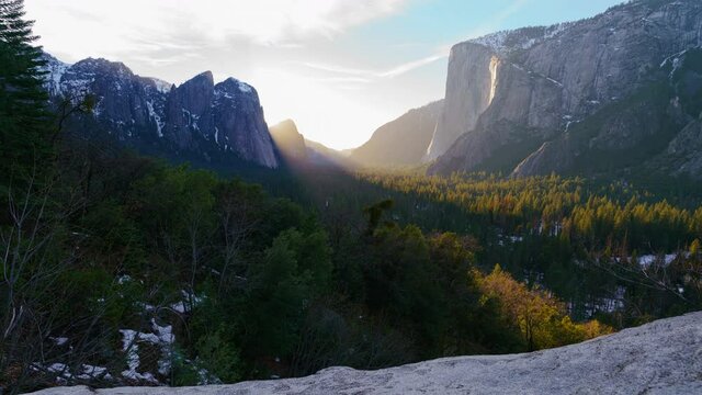 Time lapse tracking shot of Firefall, a seasonal waterfall illuminated by the late sunlight in Yosemite National Park in California