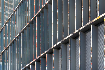 Facing the building with a ventilated facade. Aluminum colored facades. Modern facades of high-rise...