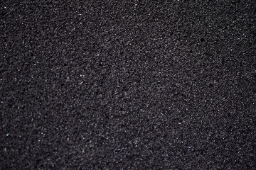 Black background made of foam rubber and polystyrene in holes
