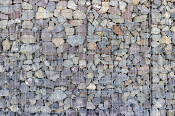  background of gabion wall from steel mesh and large stones