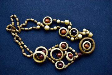 Wooden beautiful round beads on black background