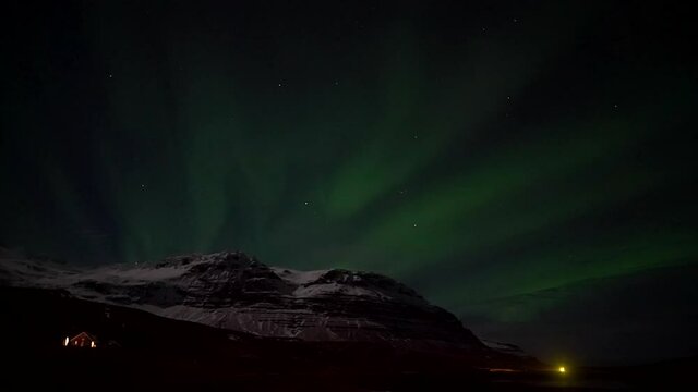 Vivid Northern Lights at Kirkjufell and Truck Driving Past - Icelandic scenery