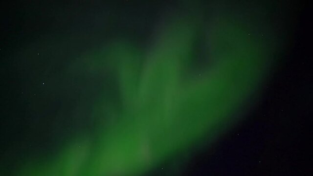 Vivid Green Northern Lights Corona Exploding in Iceland Night Sky - real time video.