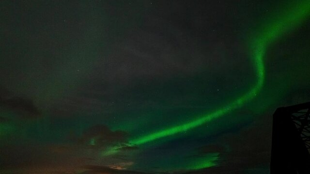 Green and purple Northern lights over south Iceland - time lapse video