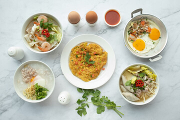 American and Thai breakfast set on the marble background