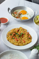American and Thai breakfast set on the marble background