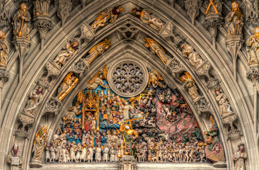 Detail of Judgment day sculpture at the gates tympanum of the Bern Cathedral in Switzerland