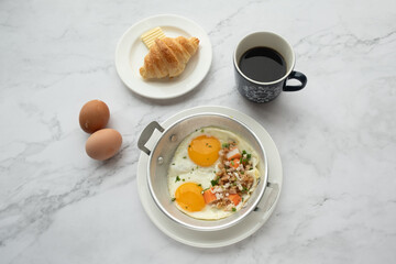 American and Thai breakfast set on the marble background