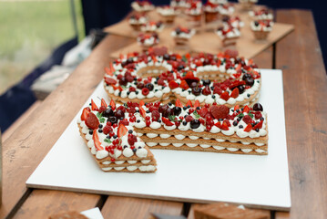 Birthday cake coming of age. Numbers cake with berries.