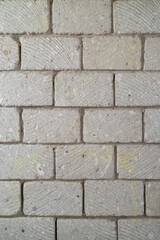 wall built of stone blocks of tuff