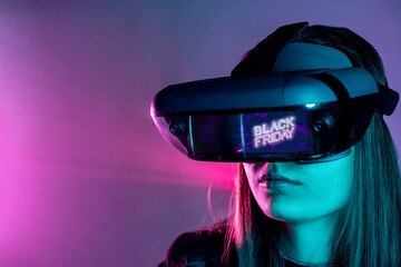 Unrecognizable female wearing VR headset while exploring virtual reality under blue neon light