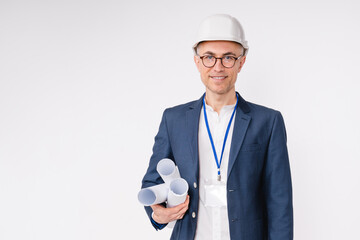 Confident caucasian mature engineer with architectural plans isolated over white background