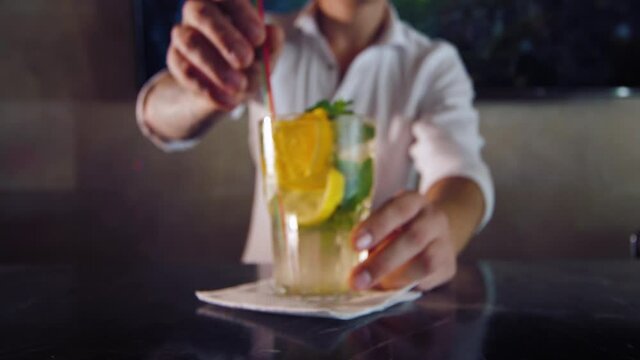 bartender prepares a cocktail lemonade
