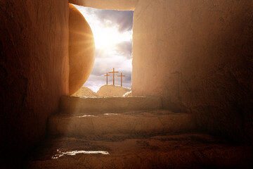 Crucifixion and Resurrection. Empty tomb of Jesus with crosses in the background. Easter or Resurrection concept. He is Risen. Happy Easter. - obrazy, fototapety, plakaty