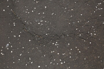 Obraz premium Gray Asphalt with Small Stones Close Up Background