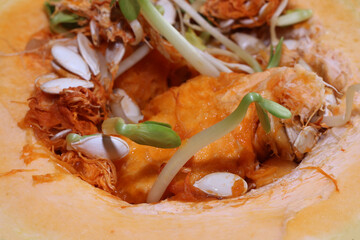 Pumpkin with sprouted seeds and fibers inside. Selective focus