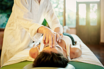 Crop male practitioner healing female patient with palm technique for recovering soul and body