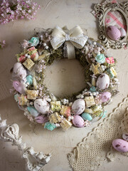 Easter wreath in pink tones on a beige background