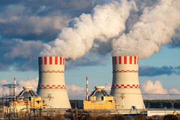 Cooling towers of Nuclear power plant emissions of steam in the air atmosphere. Industrial zone...