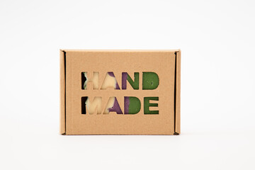 Handmade soap in a cardboard box. Packaging with the inscription: handmade