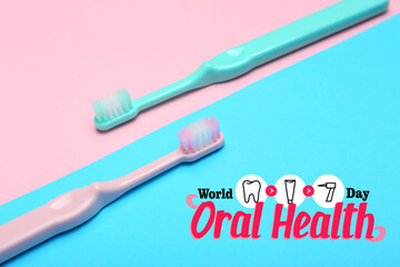 Tooth brushes on color background. World Oral Health Day