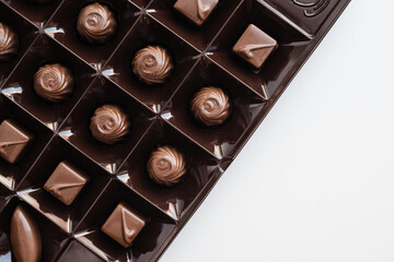 assorted candies on a white background, candies in a box, a set of chocolates, chocolates 