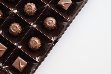 assorted candies on a white background, candies in a box, a set of chocolates, chocolates 
