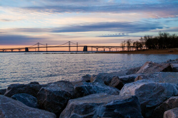 Naklejka na ściany i meble dramatic spring sunrise in Maryland with the Chesapeake Bay and Key Bridge on the background.