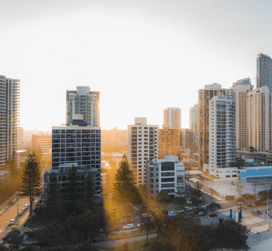 Drone view of modern skyscrapers and multistory buildings located in city district against cloudless sundown sky in Australia