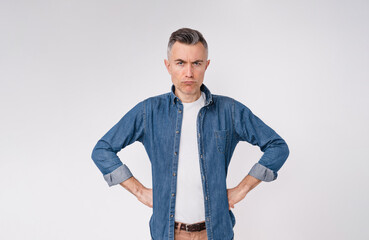 Offended mature man blowing lips isolated over white background