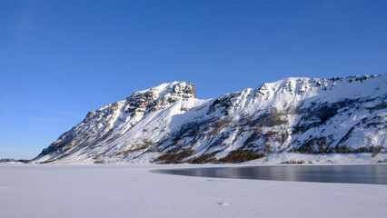 Fototapeta na wymiar Lofoten Island mountains and frozen sea, Lofoten, North Norway
