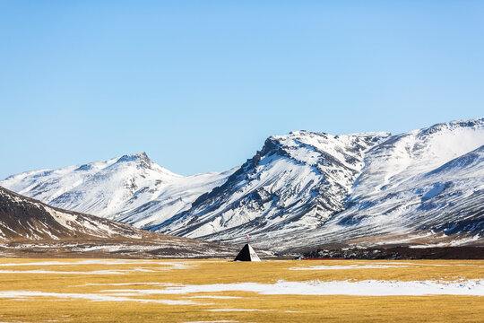 Spectacular landscape of wigwam located in valley in highlands covered with snow on sunny day in winter in Iceland