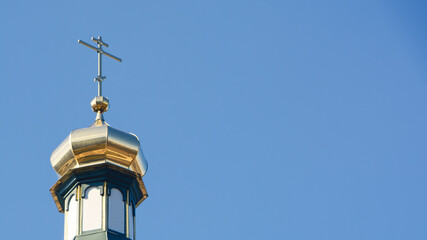 Fototapeta na wymiar golden cross on a sky. Cross on the church roof 