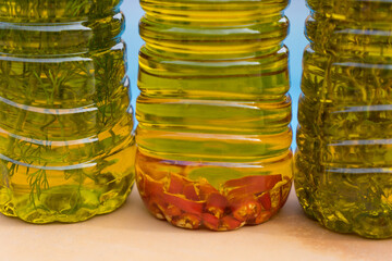 selection of aromatic olive oils enriched with spicy chili and mediterranean herbs