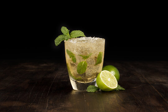 Closeup of a mojito with lots of ice on a table